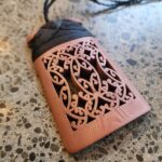 Copper Toki Pendant 3D printed with traditional maori binding in black waxed cord front view