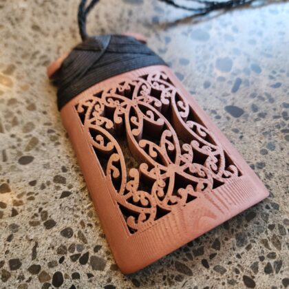 Copper Toki Pendant 3D printed with traditional maori binding in black waxed cord front view